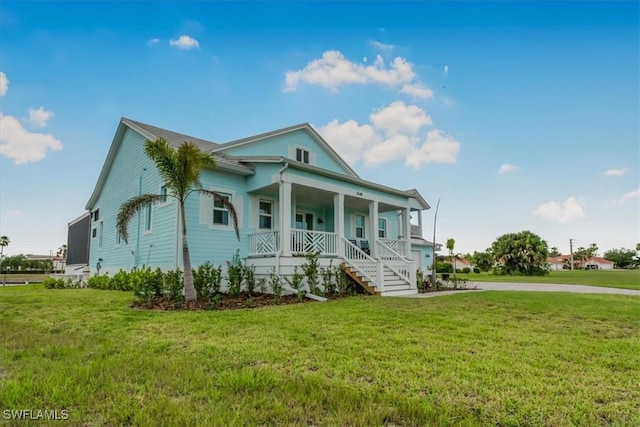3548 Mondovi Ct, Punta Gorda, FL 33950 - view of front of home with a porch, a front yard, and stairway