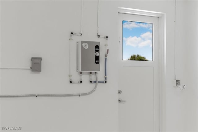 3548 Mondovi Ct, Punta Gorda, FL 33950 - utility room featuring tankless water heater