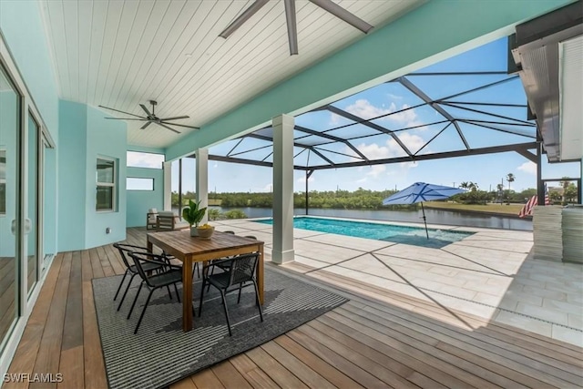 3548 Mondovi Ct, Punta Gorda, FL 33950 - swimming pool featuring ceiling fan, outdoor dining area, a patio area, and a deck with water view