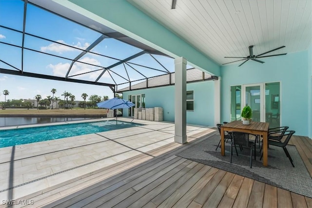 3548 Mondovi Ct, Punta Gorda, FL 33950 - outdoor pool with a ceiling fan, a patio area, glass enclosure, and outdoor dining space