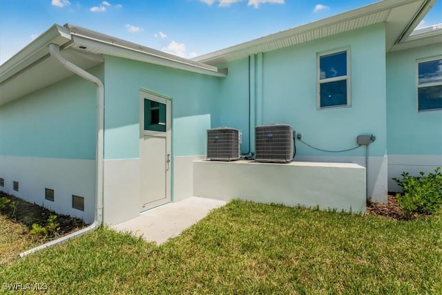 3548 Mondovi Ct, Punta Gorda, FL 33950 - view of side of property featuring stucco siding and a lawn