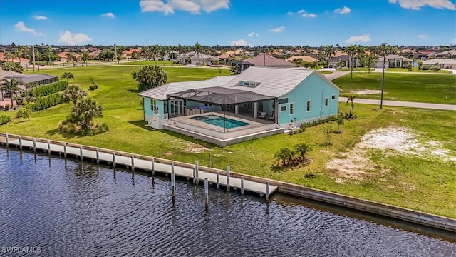 3548 Mondovi Ct, Punta Gorda, FL 33950 - rear view of house with a residential view, a water view, a lanai, a yard, and an outdoor pool