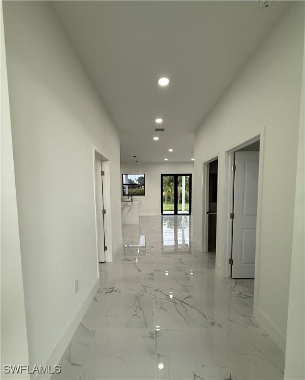 2035 NE 9th Ave, Cape Coral, FL 33909 - corridor with recessed lighting and light marble finish flooring
