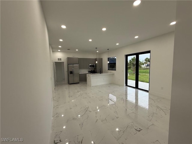 2035 NE 9th Ave, Cape Coral, FL 33909 - unfurnished living room featuring recessed lighting and light marble finish flooring