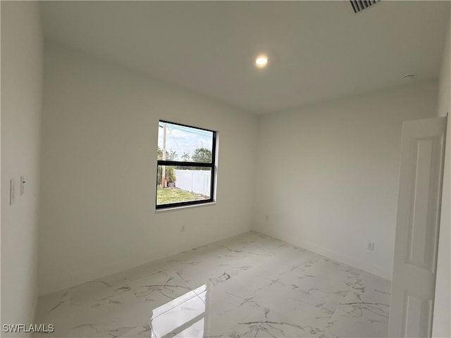 2035 NE 9th Ave, Cape Coral, FL 33909 - spare room featuring marble finish floors and recessed lighting