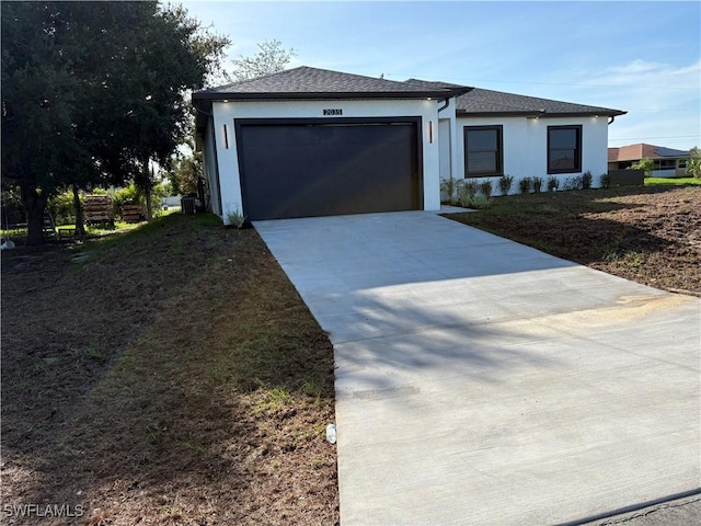 2035 NE 9th Ave, Cape Coral, FL 33909 - view of front of home featuring concrete driveway, an attached garage, and stucco siding