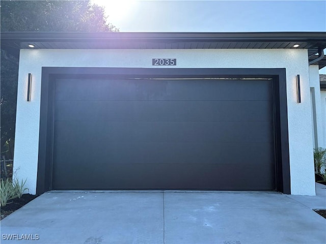 2035 NE 9th Ave, Cape Coral, FL 33909 - garage featuring concrete driveway