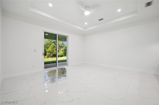 2401-2403 Quentin Ave S, Lehigh Acres, FL 33973 - unfurnished room featuring marble finish flooring, a tray ceiling, and recessed lighting