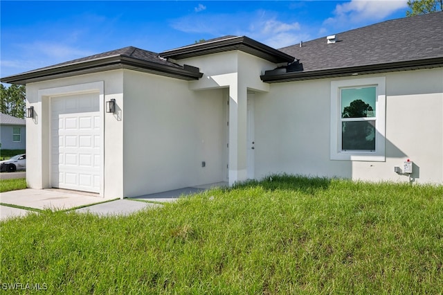 2401-2403 Quentin Ave S, Lehigh Acres, FL 33973 - doorway to property with a garage, a shingled roof, a yard, and stucco siding