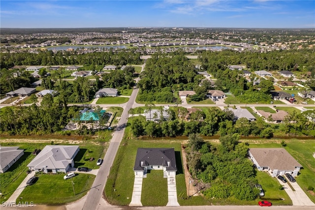 2401-2403 Quentin Ave S, Lehigh Acres, FL 33973 - aerial view of property and surrounding area with nearby suburban area and a large body of water