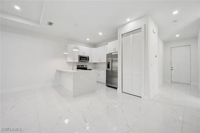 2401-2403 Quentin Ave S, Lehigh Acres, FL 33973 - kitchen with appliances with stainless steel finishes, a peninsula, light countertops, recessed lighting, and light marble finish floors