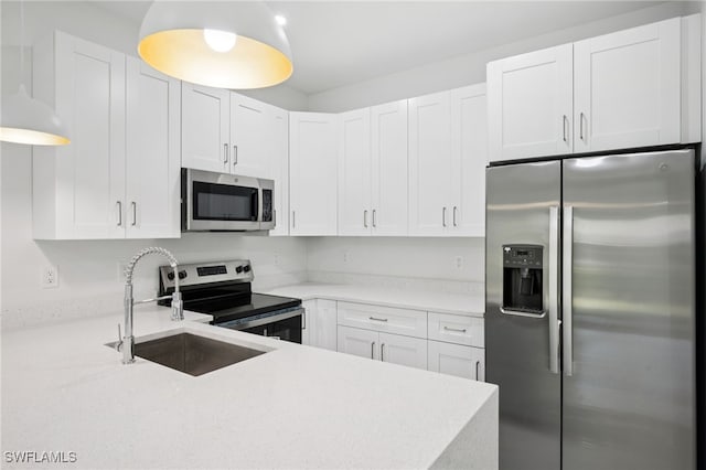 2401-2403 Quentin Ave S, Lehigh Acres, FL 33973 - kitchen featuring stainless steel appliances and white cabinets
