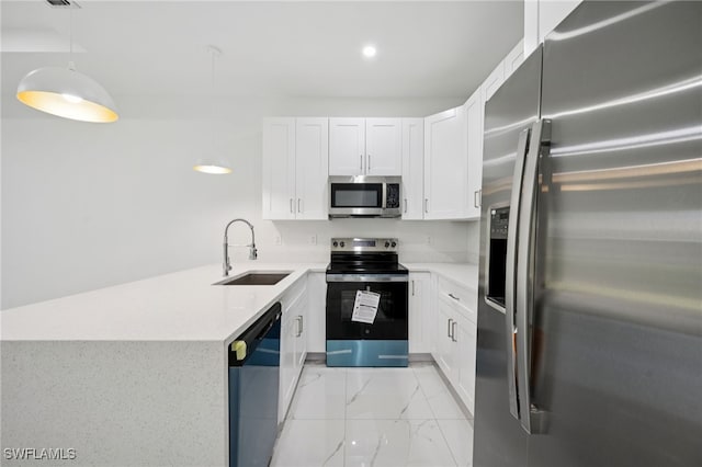 2401-2403 Quentin Ave S, Lehigh Acres, FL 33973 - kitchen featuring stainless steel appliances, light marble finish flooring, white cabinets, pendant lighting, and a peninsula