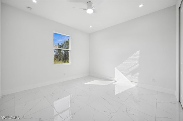 2401-2403 Quentin Ave S, Lehigh Acres, FL 33973 - unfurnished room featuring marble finish floors, ceiling fan, recessed lighting, and a smoke detector