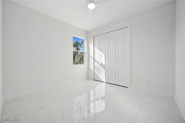 2401-2403 Quentin Ave S, Lehigh Acres, FL 33973 - unfurnished bedroom featuring marble look tile flooring and ceiling fan
