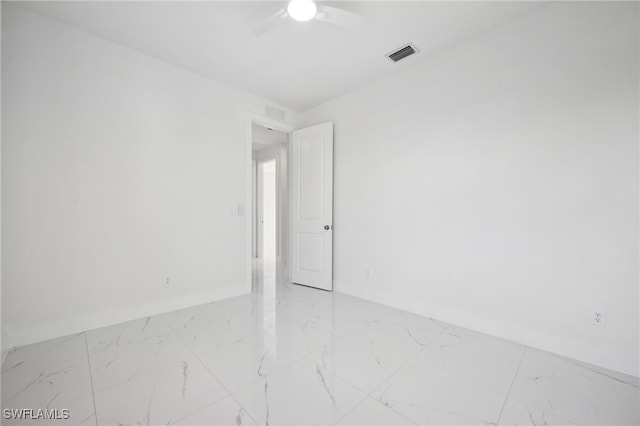2401-2403 Quentin Ave S, Lehigh Acres, FL 33973 - unfurnished room featuring light marble finish flooring and ceiling fan
