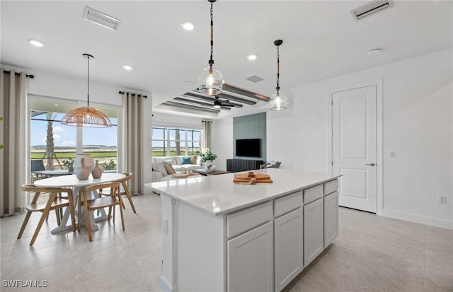 604 Oasis Lake Pl, Lehigh Acres, FL 33936 - kitchen with a center island, open floor plan, recessed lighting, light countertops, and hanging light fixtures