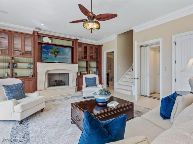 504 Tigertail Ct, Marco Island, FL 34145 - living area featuring ornamental molding, a ceiling fan, stairs, and a fireplace with raised hearth