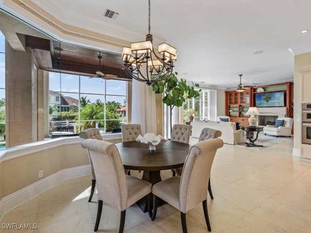 504 Tigertail Ct, Marco Island, FL 34145 - dining space with ceiling fan, ornamental molding, and a chandelier