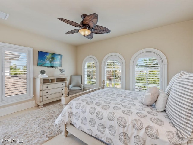 504 Tigertail Ct, Marco Island, FL 34145 - bedroom featuring a ceiling fan and baseboards