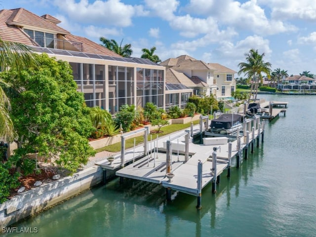 504 Tigertail Ct, Marco Island, FL 34145 - dock area featuring boat lift, a water view, and a residential view