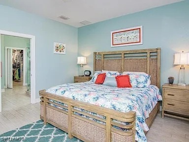 27329 Jolly Roger Ln, Bonita Springs, FL 34135 - bedroom with wood finished floors