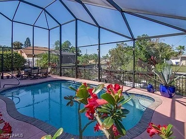 27329 Jolly Roger Ln, Bonita Springs, FL 34135 - view of pool with a patio and glass enclosure