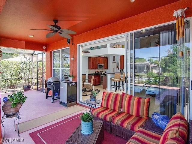 27329 Jolly Roger Ln, Bonita Springs, FL 34135 - view of patio featuring ceiling fan, grilling area, glass enclosure, and an outdoor living space