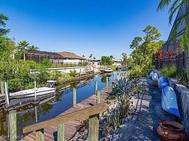 27329 Jolly Roger Ln, Bonita Springs, FL 34135 - dock featuring a water view