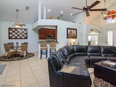 27329 Jolly Roger Ln, Bonita Springs, FL 34135 - living area with a ceiling fan, high vaulted ceiling, light tile patterned flooring, and recessed lighting