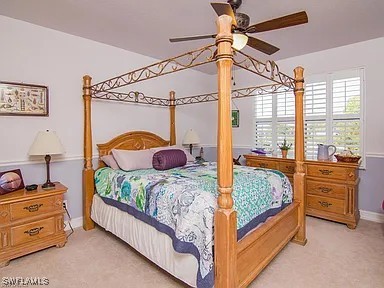 27329 Jolly Roger Ln, Bonita Springs, FL 34135 - carpeted bedroom featuring baseboards and a ceiling fan