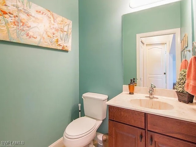 27329 Jolly Roger Ln, Bonita Springs, FL 34135 - half bathroom featuring vanity and toilet