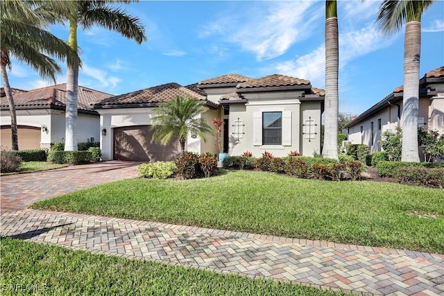 2786 Aviamar Cir, Naples, FL 34114 - mediterranean / spanish-style house with decorative driveway, an attached garage, stucco siding, and a front yard