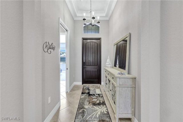 2786 Aviamar Cir, Naples, FL 34114 - foyer entrance featuring ornamental molding, a chandelier, a towering ceiling, and a raised ceiling