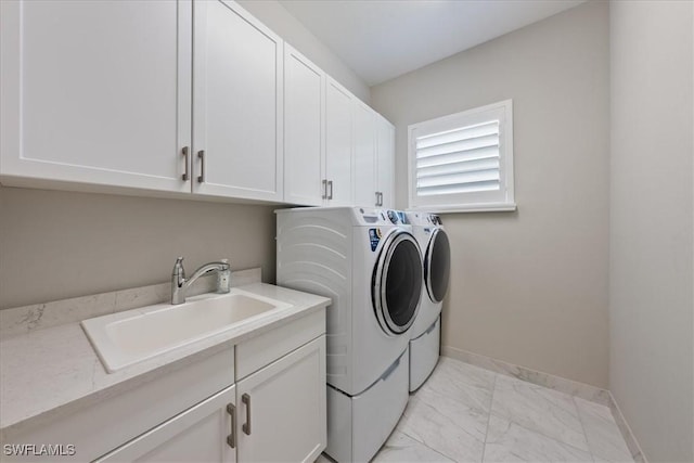 28646 Lobos Cir, Bonita Springs, FL 34135 - laundry room with washing machine and clothes dryer, light marble finish flooring, and cabinet space
