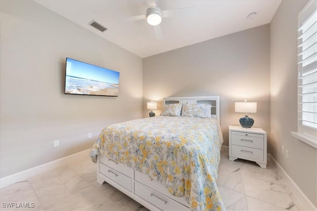 28646 Lobos Cir, Bonita Springs, FL 34135 - bedroom featuring light marble finish flooring and ceiling fan