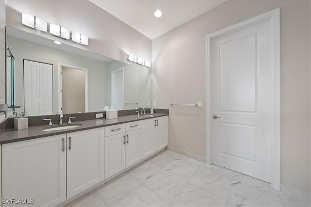28646 Lobos Cir, Bonita Springs, FL 34135 - bathroom featuring marble look tiles, double vanity, and recessed lighting