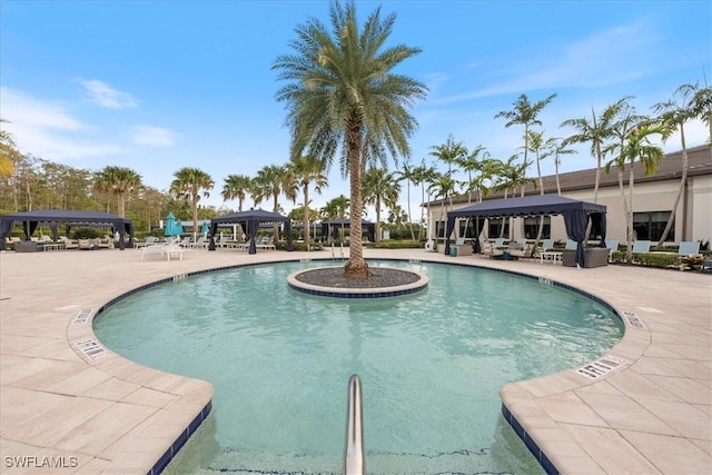 28646 Lobos Cir, Bonita Springs, FL 34135 - community pool featuring a gazebo and a patio area