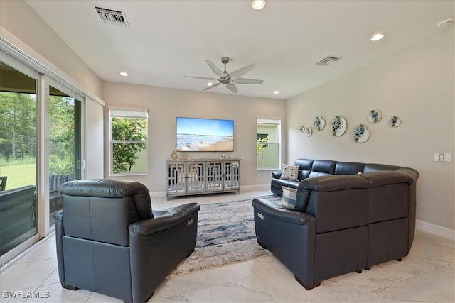 28646 Lobos Cir, Bonita Springs, FL 34135 - living area with plenty of natural light, ceiling fan, recessed lighting, and light marble finish flooring
