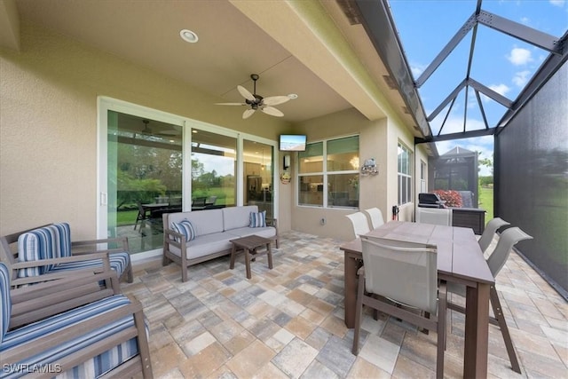 28646 Lobos Cir, Bonita Springs, FL 34135 - view of patio with ceiling fan, an outdoor living space, outdoor dining space, and glass enclosure