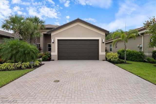 28646 Lobos Cir, Bonita Springs, FL 34135 - single story home featuring decorative driveway, stucco siding, an attached garage, and a front yard