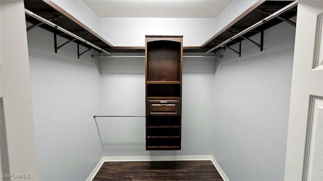 3940 Ruxton Rd, Naples, FL 34116 - walk in closet with wood finished floors