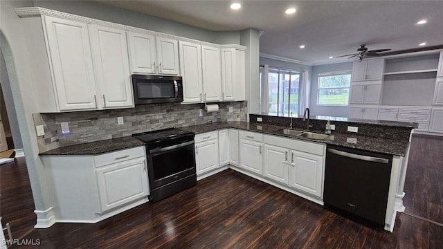 3940 Ruxton Rd, Naples, FL 34116 - kitchen with dishwashing machine, black electric range, a peninsula, dark wood-style flooring, and recessed lighting