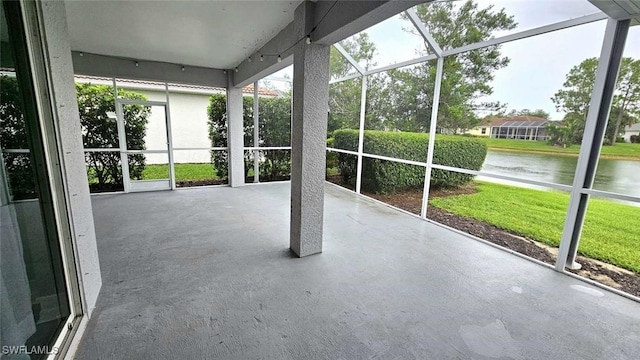 3940 Ruxton Rd, Naples, FL 34116 - unfurnished sunroom with a water view and healthy amount of natural light