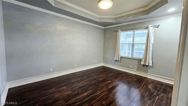 3940 Ruxton Rd, Naples, FL 34116 - spare room featuring dark wood-style flooring, a raised ceiling, and crown molding
