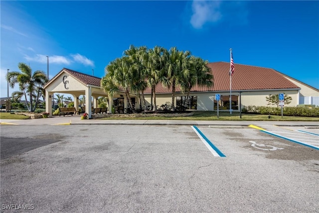 11060 Caravel Cir Unit 104, Fort Myers, FL 33908 - view of building exterior with uncovered parking