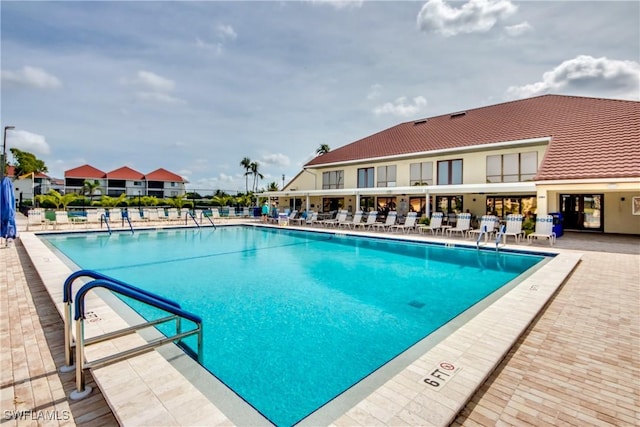 11060 Caravel Cir Unit 104, Fort Myers, FL 33908 - community pool featuring a patio area