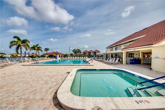11060 Caravel Cir Unit 104, Fort Myers, FL 33908 - community pool with a patio area