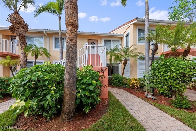 2365 Bayou Ln Unit 10, Naples, FL 34112 - view of front facade featuring stucco siding and a tile roof