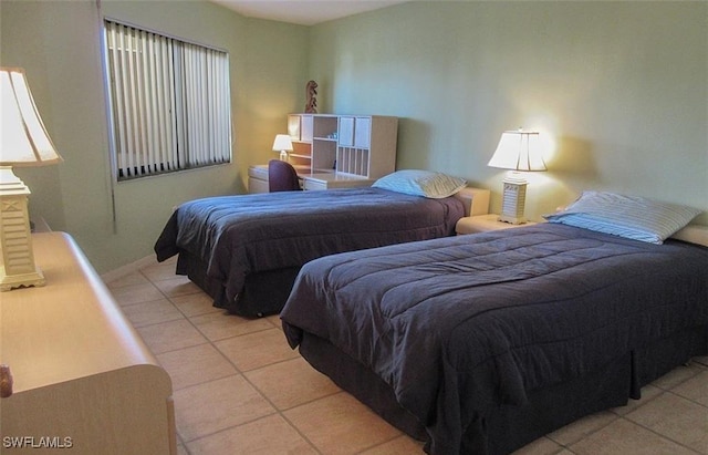 4265 Bay Beach Ln Unit 524, Fort Myers Beach, FL 33931 - bedroom featuring light tile patterned flooring and baseboards